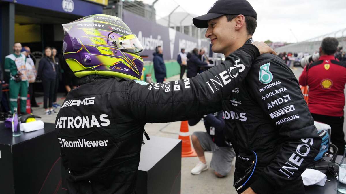 British Formula One driver Lewis Hamilton of Mercedes-AMG Petronas (L) pats teammate George Russell of after the qualifying session at the Formula One Grand Prix of Australia at the Albert Park Circuit in Melbourne, Australia,