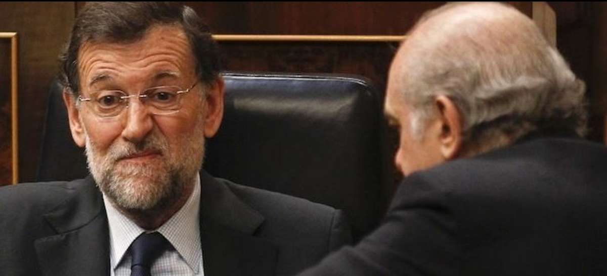 El expresidente Mariano Rajoy junto al exministro del Interior Jorge Fernández Díaz.